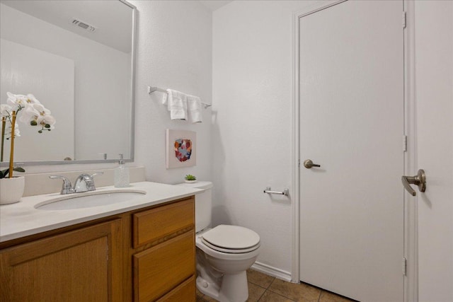 11009 Roderick Lawson Ln, Austin, TX 78754 - half bathroom featuring vanity, toilet, and tile patterned flooring