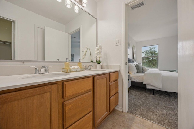 11009 Roderick Lawson Ln, Austin, TX 78754 - ensuite bathroom with double vanity and tile patterned flooring
