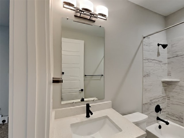 full bathroom with vanity, toilet, and tiled shower / bath