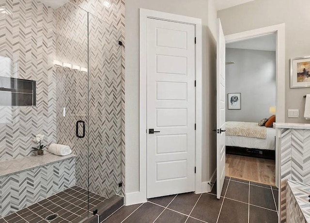 bathroom with tile patterned flooring and an enclosed shower