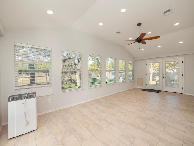 unfurnished sunroom with vaulted ceiling, french doors, and ceiling fan