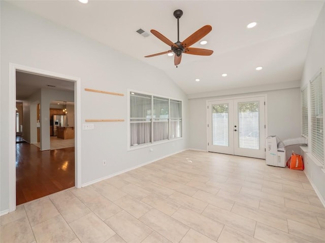 spare room featuring french doors, ceiling fan, and vaulted ceiling