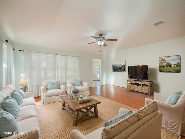 living room with ceiling fan and light hardwood / wood-style floors