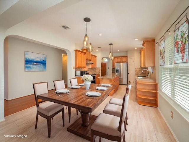 dining space featuring sink