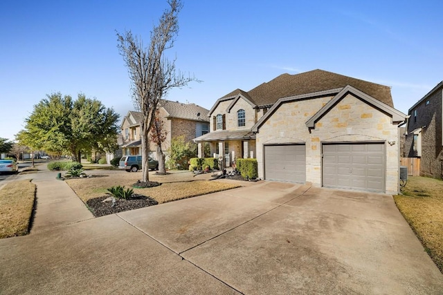 french country home with an attached garage, central AC, concrete driveway, stone siding, and a residential view