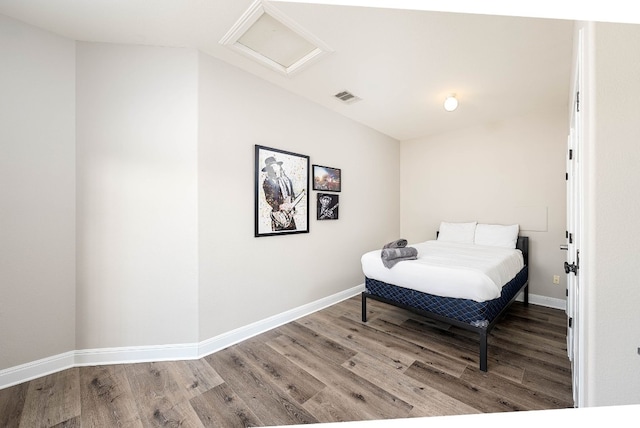 bedroom with hardwood / wood-style flooring