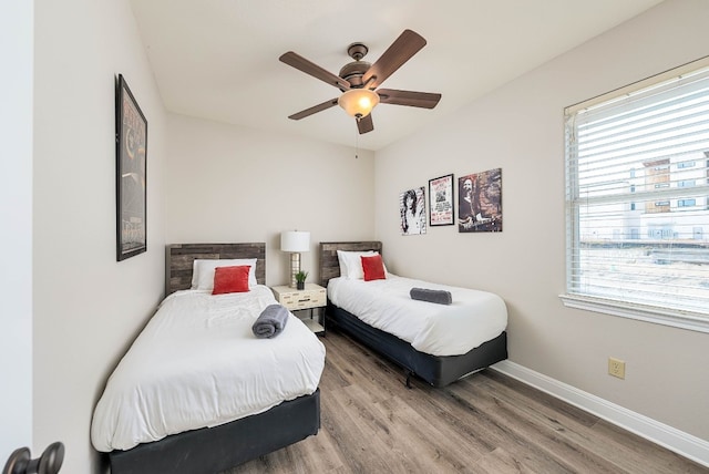 bedroom with hardwood / wood-style flooring and ceiling fan