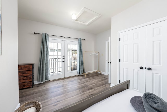 bedroom with access to exterior, hardwood / wood-style flooring, a closet, and french doors