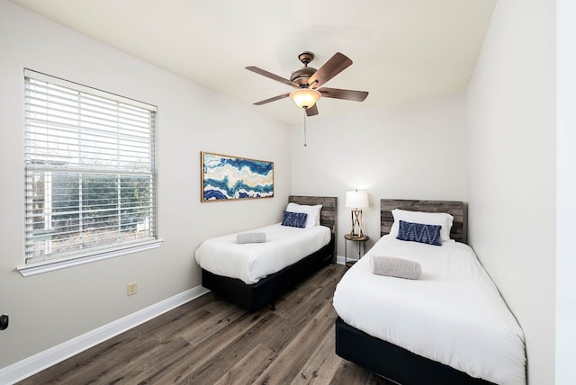 bedroom featuring dark hardwood / wood-style floors and ceiling fan