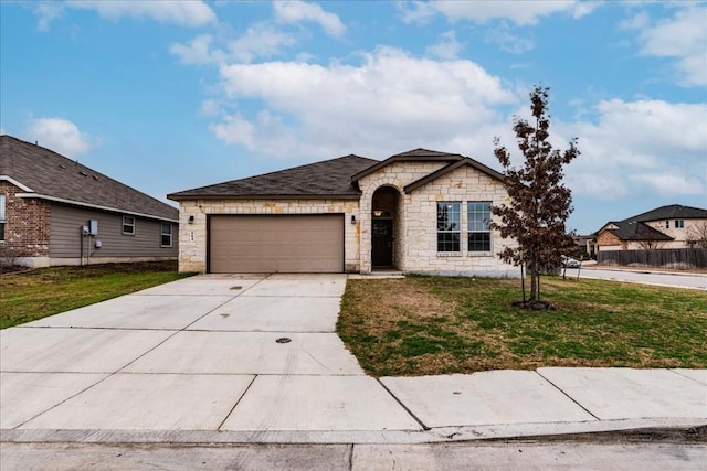 view of front of house with a garage and a front lawn