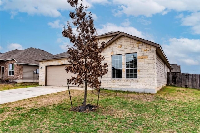 view of front of property with a garage and a front yard