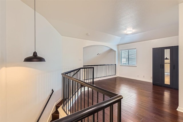 interior space with lofted ceiling and wood-type flooring