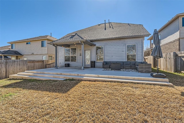 rear view of property featuring outdoor lounge area, a yard, a deck, and a patio area