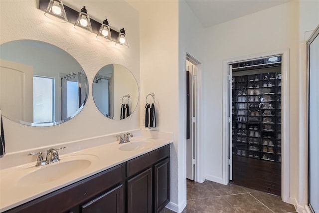 bathroom with tile patterned flooring and vanity