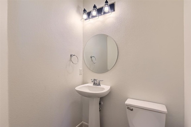 bathroom with sink and toilet