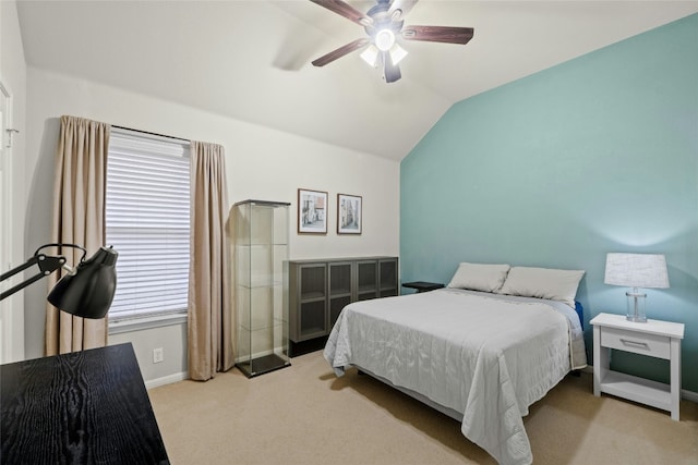 carpeted bedroom featuring lofted ceiling and ceiling fan