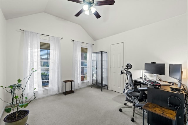 carpeted home office featuring ceiling fan and lofted ceiling