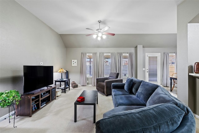 living room with lofted ceiling, light colored carpet, and ceiling fan