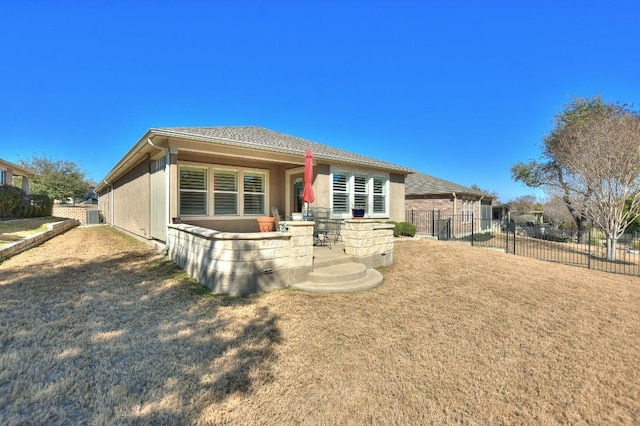 rear view of house featuring central AC and a patio area