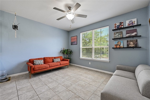 living room with ceiling fan and light tile patterned floors