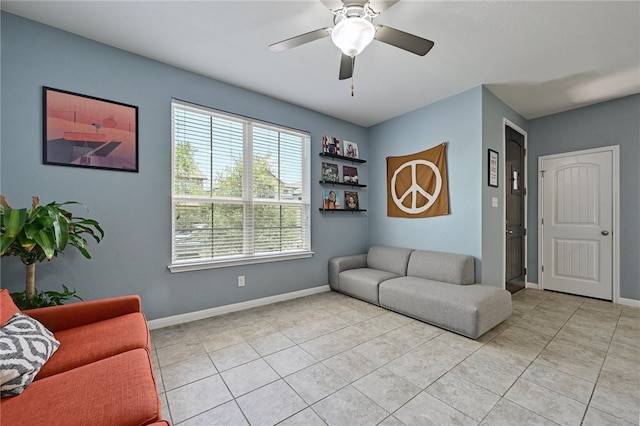 living room with ceiling fan and light tile patterned floors