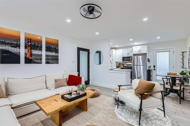 1200 E 52nd St Unit 108, Austin, TX 78723 - living room featuring light wood finished floors and recessed lighting