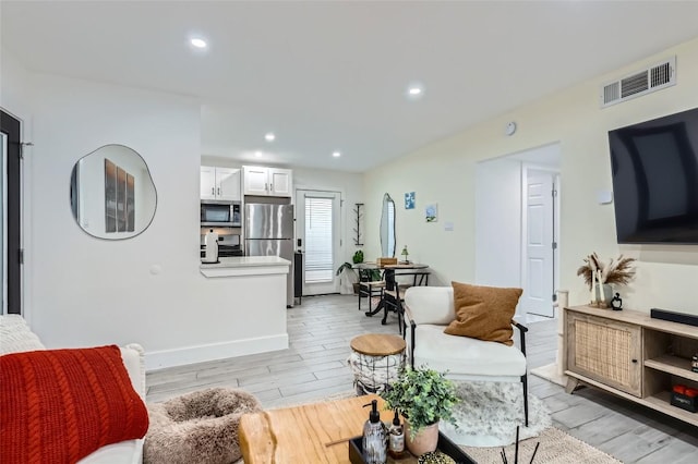 1200 E 52nd St Unit 108, Austin, TX 78723 - living area featuring light wood-type flooring and recessed lighting