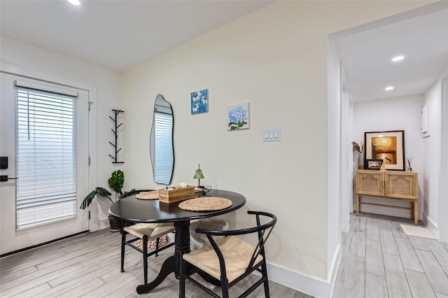 dining area featuring light wood-type flooring