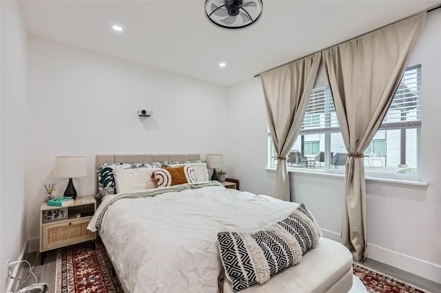 bedroom with hardwood / wood-style flooring