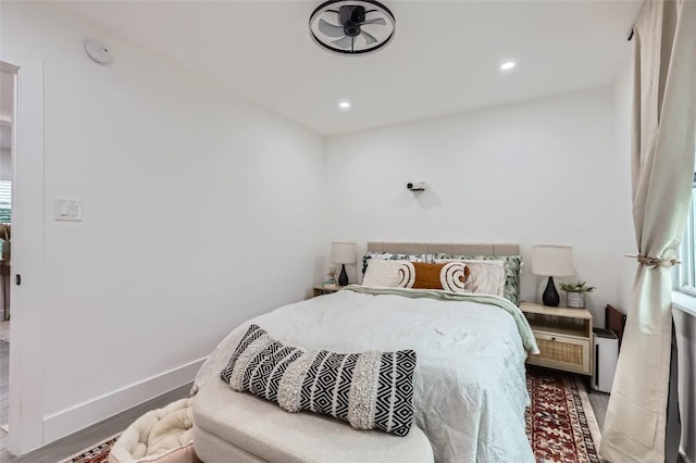 bedroom with hardwood / wood-style floors