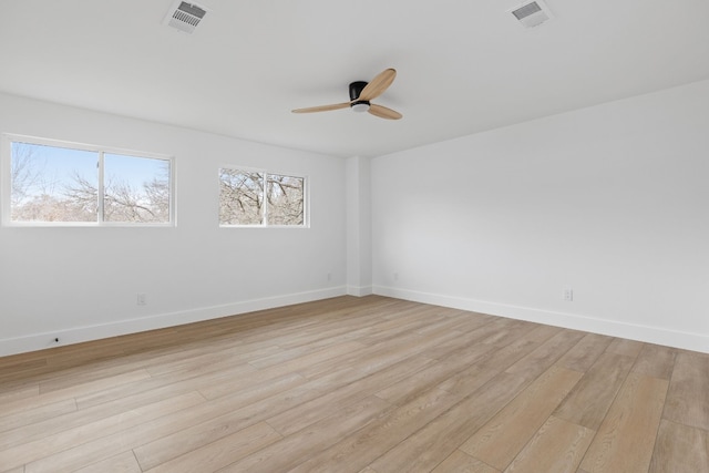 spare room featuring ceiling fan and light wood-type flooring