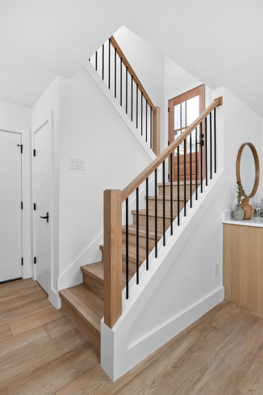 stairs with wood-type flooring