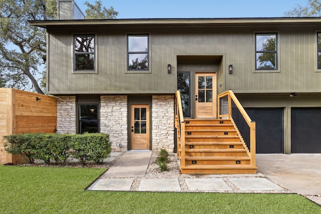 raised ranch featuring a garage