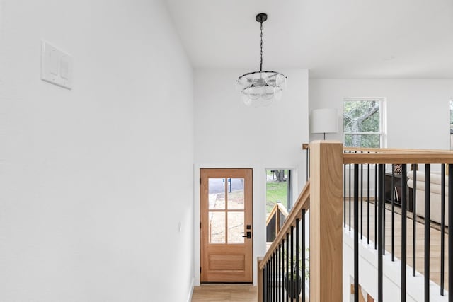 interior space with hardwood / wood-style flooring and a chandelier