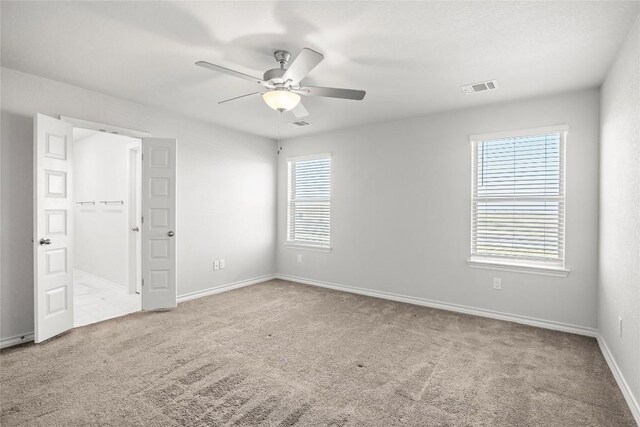 798 Eves Necklace Dr, Buda, TX 78610 - unfurnished bedroom with multiple windows, carpet, and baseboards