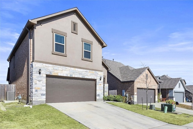 traditional home featuring stone siding, central AC unit, a front lawn, and stucco siding