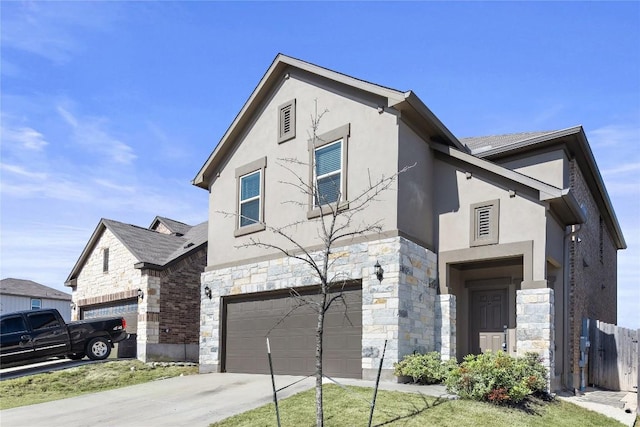 view of front of house featuring stone siding, an attached garage, driveway, and stucco siding