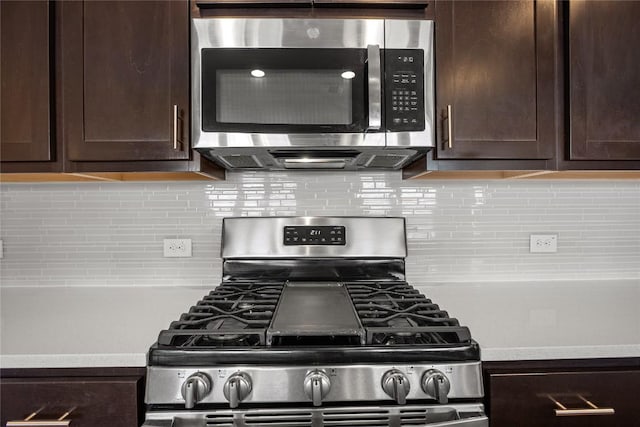 kitchen with appliances with stainless steel finishes, light countertops, dark brown cabinetry, and backsplash