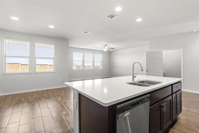 798 Eves Necklace Dr, Buda, TX 78610 - kitchen featuring a sink, stainless steel dishwasher, wood finished floors, open floor plan, and recessed lighting