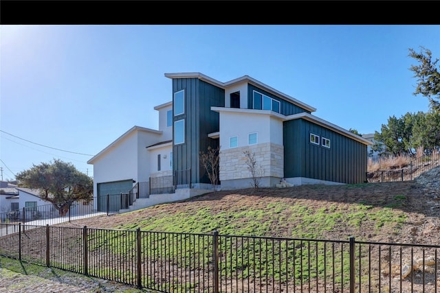 view of side of home featuring a garage