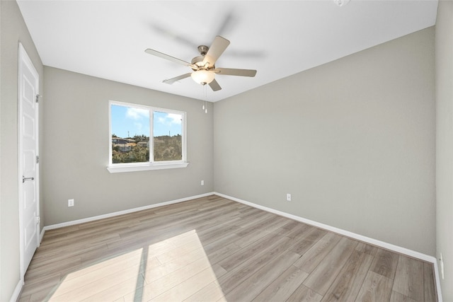 unfurnished room featuring ceiling fan and light hardwood / wood-style floors