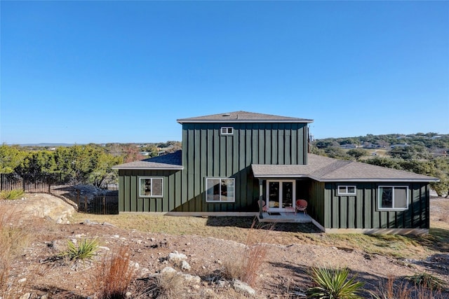 4067 Outpost Trce, Lago Vista, TX 78645 - rear view of house featuring board and batten siding, a patio area, roof with shingles, and french doors