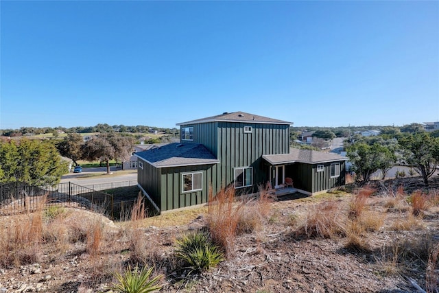 4067 Outpost Trce, Lago Vista, TX 78645 - back of property with board and batten siding and roof with shingles
