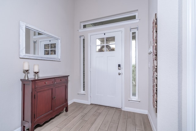 entryway with light hardwood / wood-style flooring