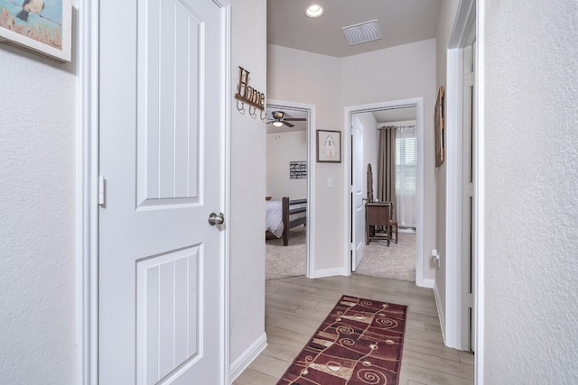 hall with light wood-type flooring