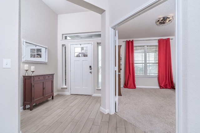 foyer with light hardwood / wood-style floors