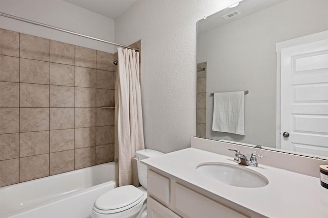 full bathroom with shower / tub combo with curtain, vanity, and toilet