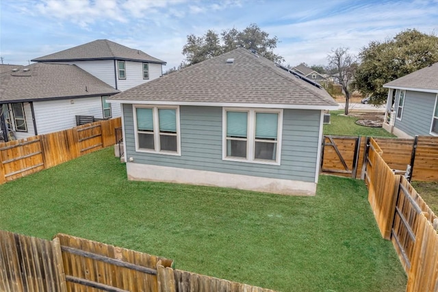 rear view of property featuring a yard