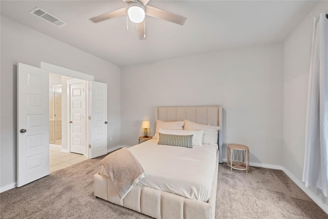 bedroom with ceiling fan and light colored carpet