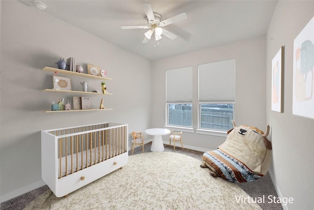 carpeted bedroom with ceiling fan